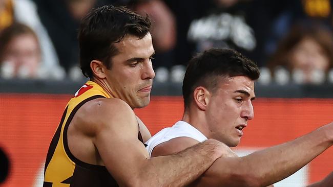 MELBOURNE, AUSTRALIA - August 5 , 2023. AFL .  Nick Daicos of the Magpies tackled by Finn Maginness of the Hawks  during the round 21 match between the Hawthorn and Collingwood at Marvel Stadium in Melbourne.   Photo by Michael Klein.