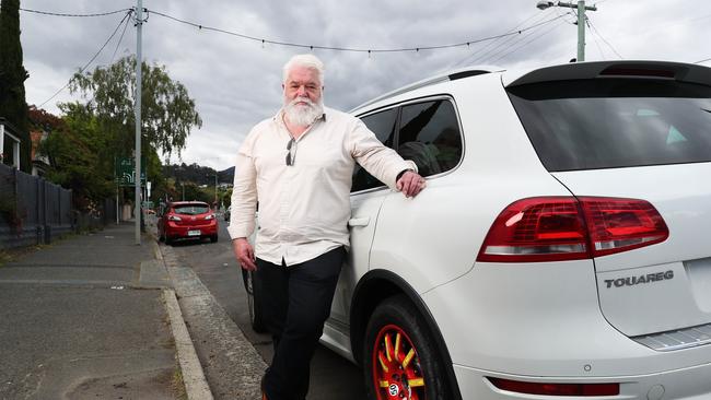 Peter Krause with the space saver tyre he now has to use after a blowout on Davey St. Picture: Nikki Davis-Jones