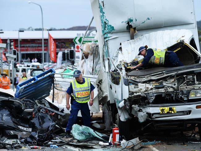 Police and RMS investigate the scene of a motor vehicle accident in October, 2014, where a truck crashed into stationary traffic at the corner of Warringah and Pittwater roads, Dee Why. Picture: Braden Fastier.