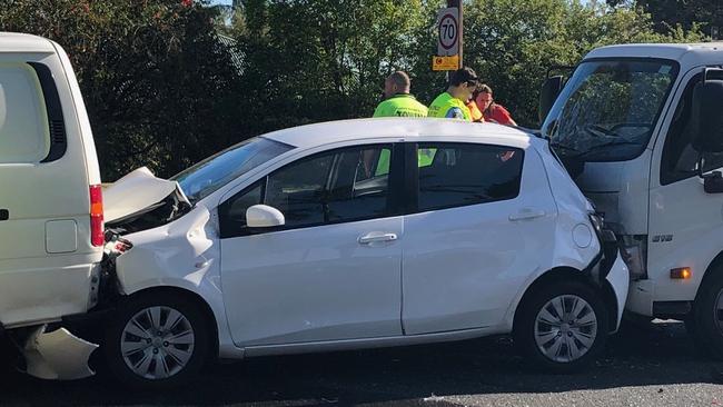 A small hatchback was crushed between a van and a tipper truck in a four-car crash westbound on Warringah Rd at Beacon Hill, near Daines Pde. Picture: Jim O'Rourke