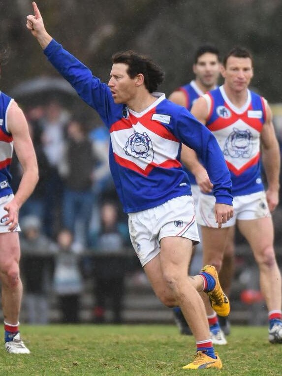 Shane Harvey celebrates a goal for North Heidelberg. Picture: Nathan McNeill