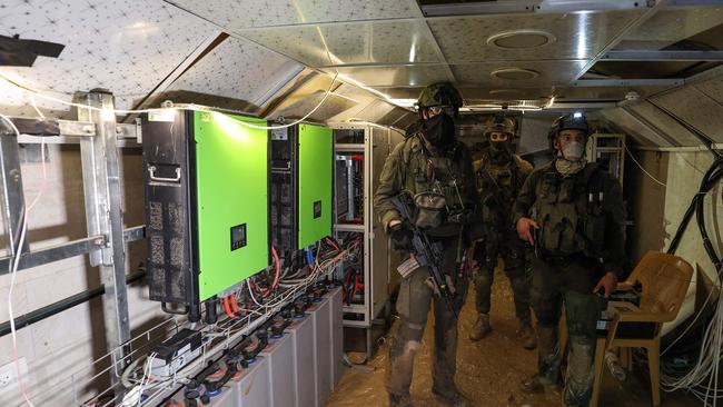 Israeli soldiers inside a tunnel that the army claimed is a Hamas command tunnel under a compound of the UNRWA in Gaza City. Picture: AFP