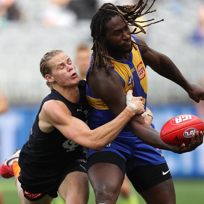 Tom De Koning lays a tackle on Nic Naitanui during Round 11.