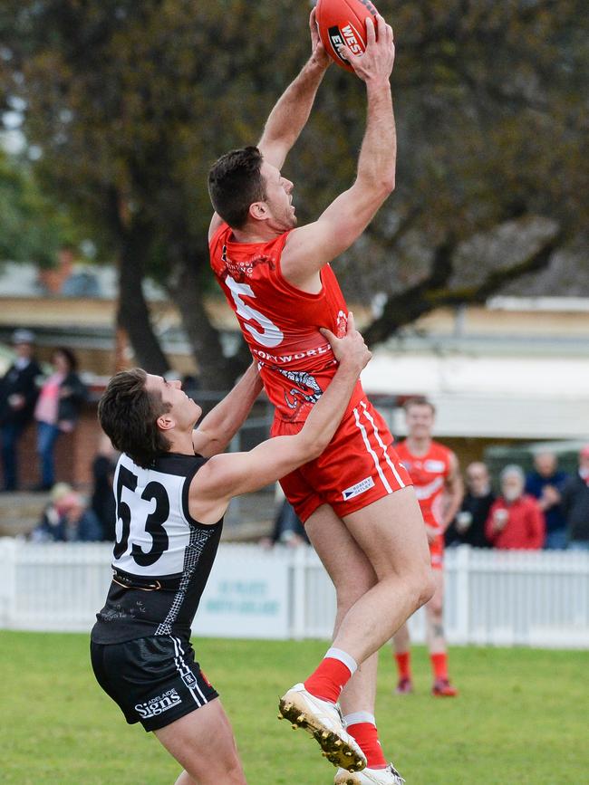 North Adelaide’s Cameron Craig takes a strong mark in front of Port Adelaide’s Jackson Lee at Prospect Oval. Picture: Brenton Edwards