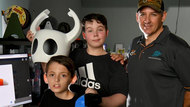 STEAMlab facilitator Andrew Schubert with Ethan, 9, and Archer, 11, with 3D printing creations at Citylibraries Riverway. Picture: Evan Morgan (no last names)