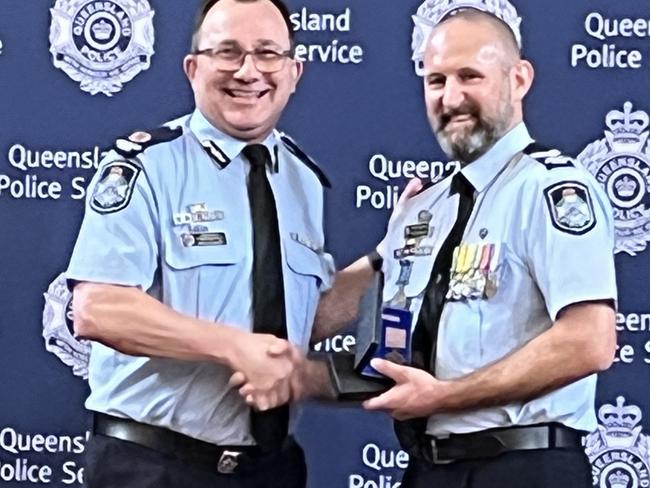 Senior Constable Matthew Walker with Assistant Commissioner Brian Connors at the police medals ceremony.