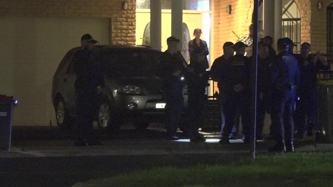 Police gather to investigate a shooting at Aubrey Street Picture: TNV