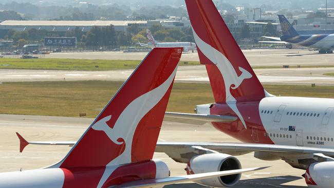 National carrier Qantas says European and North American flights will be out of action for sometime. Photo by Greg Wood/ AFP