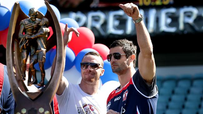 Maloney celebrates the Roosters’ grand final win with Anthony Minichiello in 2013. Image: Gregg Porteous