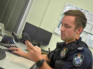 Constable James Harris puts his SMS skills to the test. Picture: Nathan Greaves