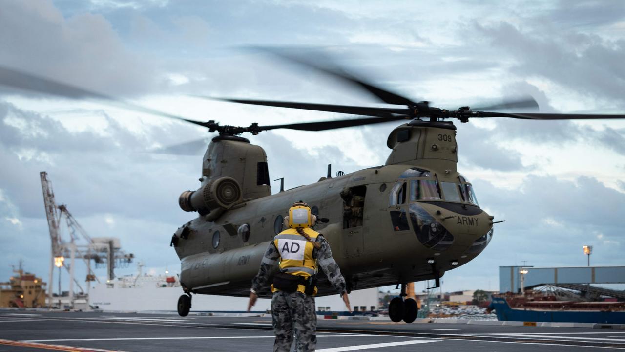 CH-47 Chinook heavy-lift helicopters lifting off from HMAS Adelaide, which departed Brisbane to bring humanitarian assistance to Tonga. Photo: AFP/ADF.