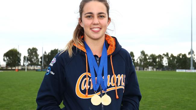 Chloe Molloy shows off her leading goalkicker and TAC Cup premiership medal with Calder Cannons. Picture: Getty Images.