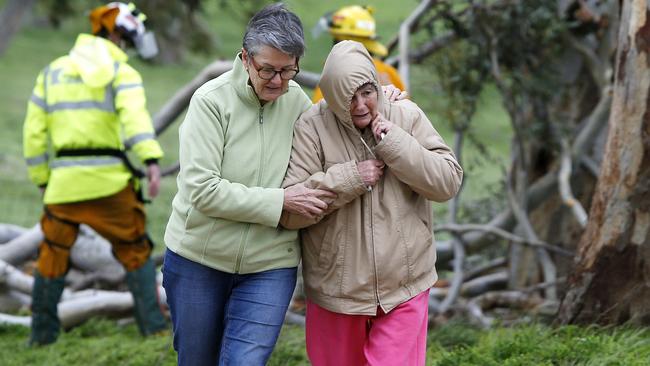 A neighbour helps the wife of Ray Fox after the well-known Harrogate local was killed by a falling tree as he cleared a road from storm debris. Picture: Simon Cross