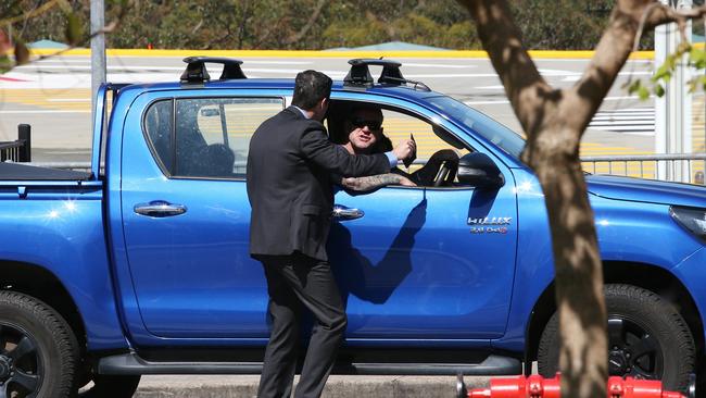 The Premier's security guard was seen speaking with the man, before he drove away. Picture NCA Newswire / Peter Lorimer.