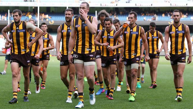 AFL Round 2. Hawthorn vs. Adelaide Crows at the MCG. Skipper Jarryd Roughead leads a disappointed Hawthorn team of the MCG. Pic: Michael Klein