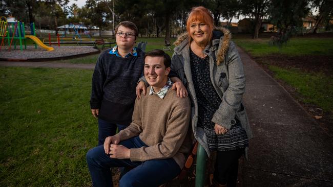 Callum Barrott-Walsh with brother Jesse and mum Allison near their housing trust home at Huntfield Heights. Picture: Tom Huntley