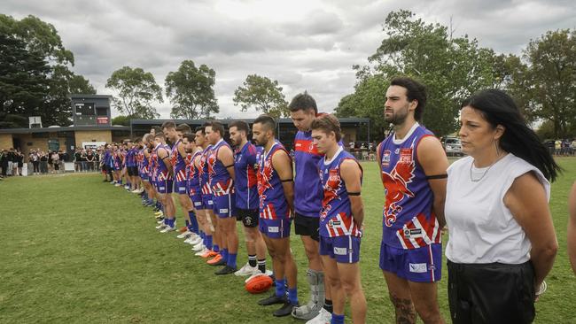 Nancy Balic and the Keysborough players line up for a minute’s silence for Harley Balic. Cooper Balic stands next to his mother. Picture: Valeriu Campan