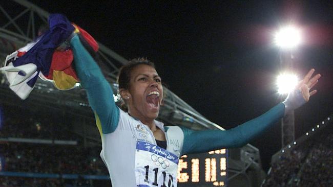 Cathy Freeman holding the Indigenous flag after winning gold at the Sydney Olympics.