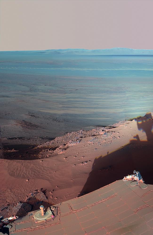 NASA's Mars Rover Opportunity catches its own late-afternoon shadow in this dramatically lit view eastwards across Endeavour Crater on Mars. (Photo by: Universal History Archive/UIG)