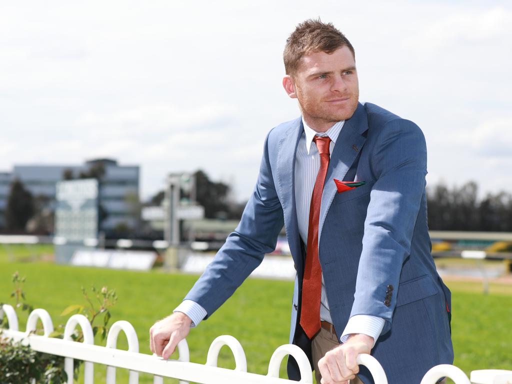 GWS Giants player, Heath Shaw poses for photographs in the new Jacket inspired by The Autumn Sun's jockey Kerrin McEvoy in Rosehill Gardens Racecourse, Rosehill. Rosehill, Thursday, September 20th 2018. Fashion label Manning Cartell has partnered with the Australian Turf Club to create a range of garments inspired by jockey silks. (AAP Image / Angelo Velardo)