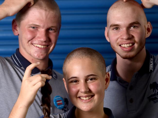 Pimlico High students Brandon Tabell, 17, Leah Feltham, , 14, and Dylan Cutler, 17, after a close shave. Picture: Evan Morgan