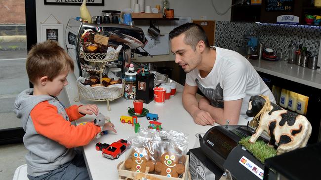 Maxxii Moo barista Hamish discusses toys with Lucas, 4. Picture: Adam Elwood