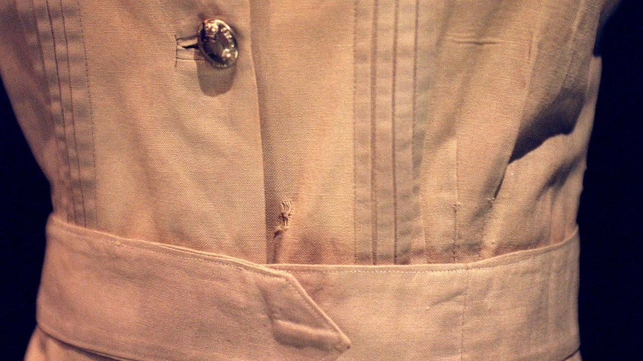 A bullet hole can be seen — at centre and just above waistband — in the uniform worn by Vivian Bullwinkel at Bangka Island.