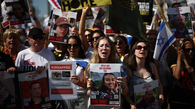 Protesters in London this week hold placards, including one of hostage Noa Argaman, centre, in a ‘United We Bring Them Home’ march to bring attention to the plight of the hostages still held in Gaza. Picture: AFP