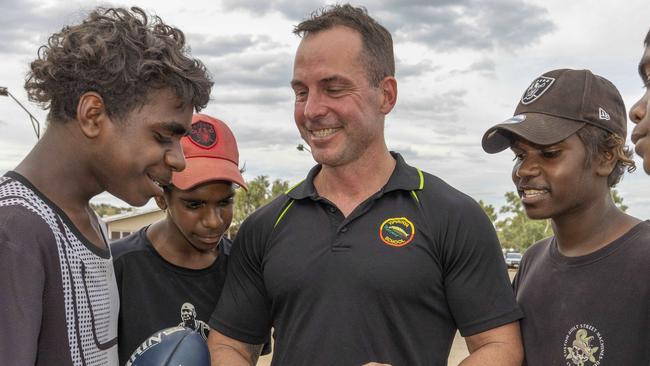 Yipirinya School principal Gavin Morris with students Malikai Hayes, Keylin Peters and Adrian Nelson. Photo: Grenville Turner