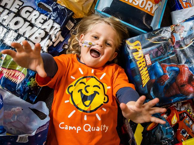 Camp Quality kid Knox, 5, with Leukemia, road testing the showbags in the Members Banquet Room, on August 18th, 2022, at the Wayville Showgrounds.Picture: Tom Huntley