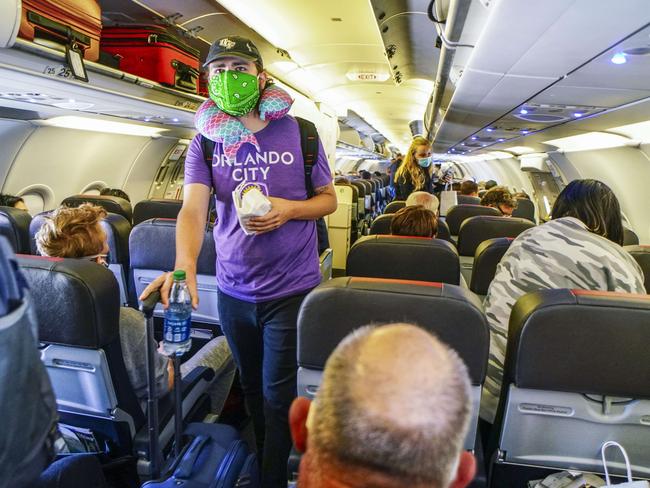 Passengers board an American Airlines flight to Charlotte, North Carolina. Picture: Getty/AFP