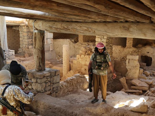 Extremists ... Islamic State Militants inside the ancient monastery of the Saint Eliane. Picture: Islamic State militant website via AP