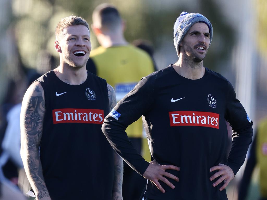 Jordan De Goey (L) shares a laugh with captain Scott Pendlebury at Collingwood training. Picture: Michael Klein