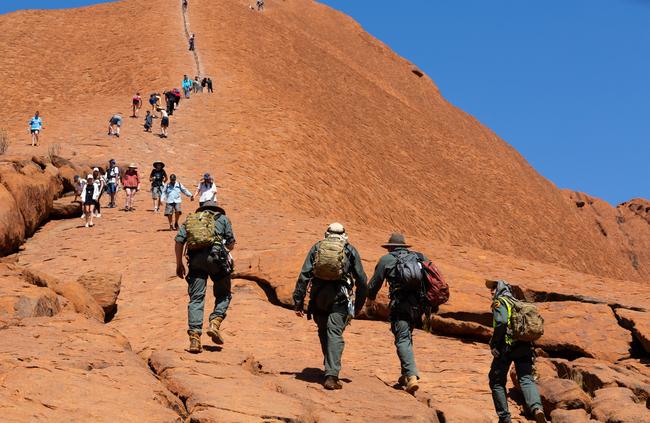 Some of the last people to ever climb Uluru on the final day it is allowed: Picture: EMMA MURRAY