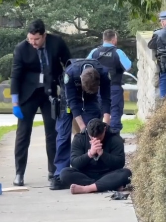 Police arrest one of the men on the day. Picture: Channel 7