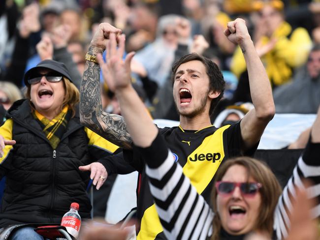 Tigers fans celebrating at Punt Rd. Picture: AAP Image/Joe Castro