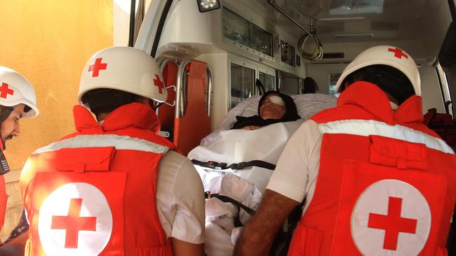 Lebanese Red Cross volunteers transport a patient to the Alaa Addin hospital in the southern town of Sarafand. Picture: Mahmoud ZAYYAT / AFP