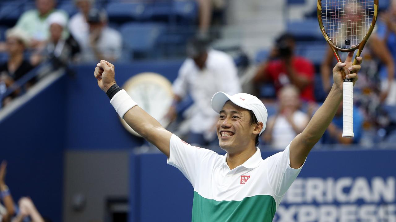 Kei Nishikori, of Japan, celebrates after defeating Marin Cilic.