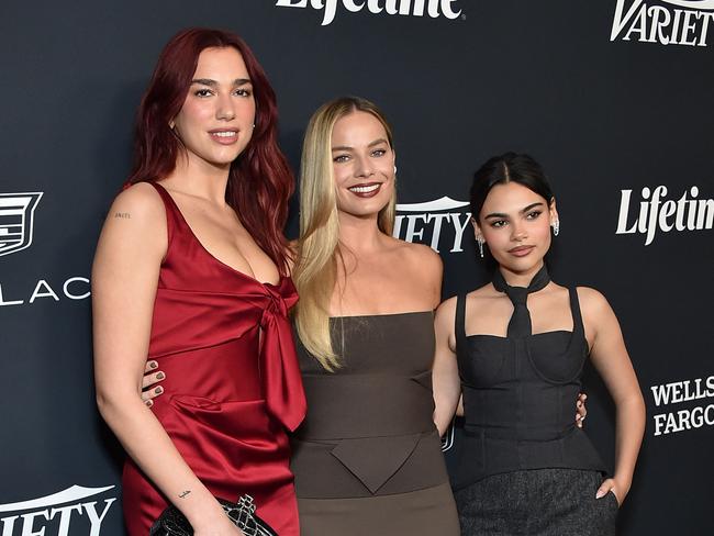 Robbie flanked by English-Albanian singer Dua Lipa and US actress Ariana Greenblatt. Picture: AFP