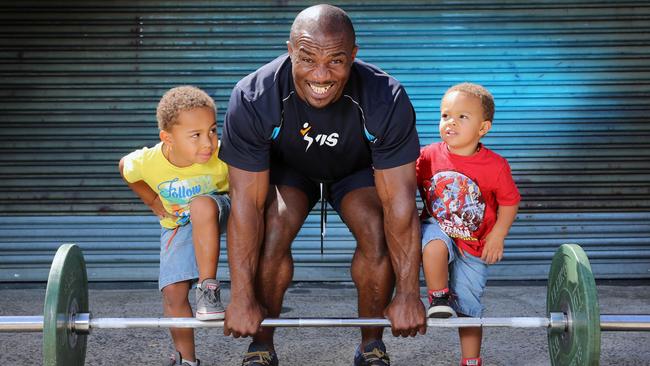 Simplice Ribouem — getting some help during training from sons Samuel, 4, and Nathan, 3, — has booked himself a ticket to Rio. Picture: Alex Coppel