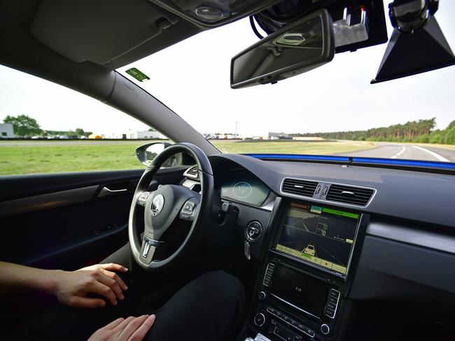 A driver presents a Cruising Chauffeur, a hands free self-driving system designed for motorways. Picture: Getty