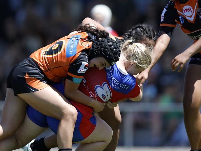 Lauren Filip is tackled by Paige Attard. Picture: Michael Gorton