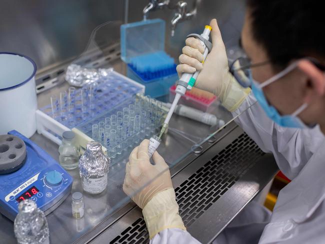 An engineer working on an experimental vaccine for COVID-19 at the Sinovac Biotech facilities in Beijing. China would make any coronavirus vaccine it developed a "global public good", President Xi Jinping told the World Health Assembly. Picture: AFP