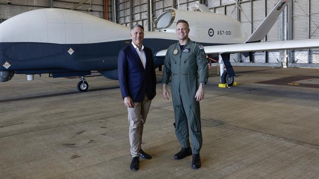 Defence Minister Richard Marles and Chief of Air Force Stephen Chappell at RAAF Tindal in Darwin with the first of four unmanned MQ-4C Triton aircraft to be delivered to the service. Picture: ADF