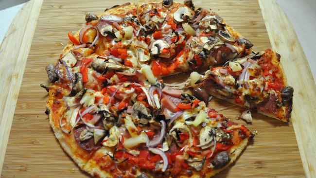 Super Supreme pizza with cheese, ham, mushroom, onion, capsicum, pineapple, olives and pepperoni. Pictures: Stacey Roberts