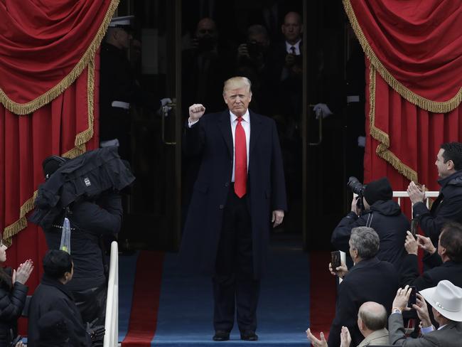 President Donald Trump pumps his fist as he arrives for his Presidential Inauguration at the U.S. Capitol in Washington on January 20, 2017. Picture: AP