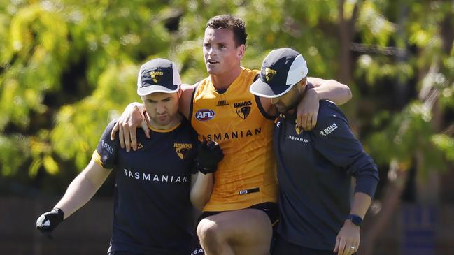 MELBOURNE , AUSTRALIA.February 15 , 2024.  AFL. Hawthorn Intraclub practise match at Waverley  Park.   James Blanck of the Hawks  is helped club staff after appearing to hurt his left knee during the clubs intra club hit out  . Pic: Michael Klein