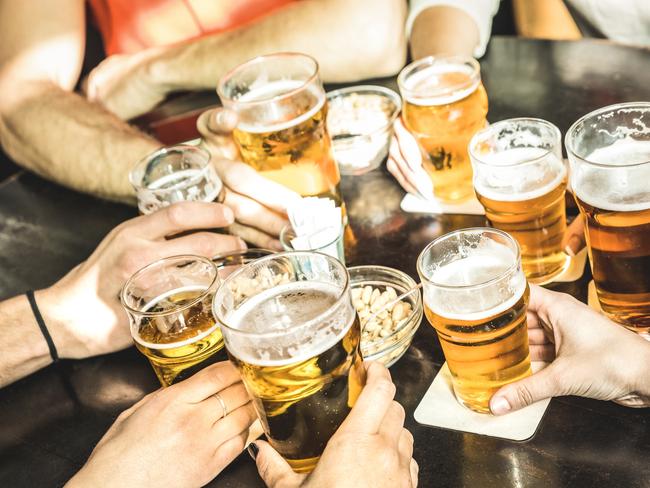 ESCAPE: UK Drink, Mikaella Clements -  Friends hands drinking beer at brewery pub restaurant - Friendship concept with young people enjoying time together and having genuine fun at cool vintage brew bar - Focus on middle right small glass . Picture: iStock