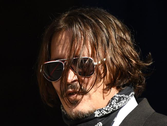 US actor Johnny Depp arrives on the fourth day of his libel trial against News Group Newspapers (NGN), at the High Court in London, on July 10, 2020. - Depp is suing the publishers of The Sun and the author of the article for the claims that called him a "wife-beater" in April 2018. (Photo by DANIEL LEAL-OLIVAS / AFP)