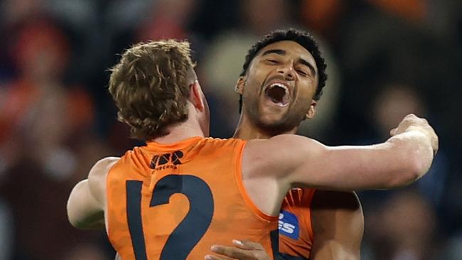 CANBERRA, AUSTRALIA - APRIL 25: Callum M. Brown of the Giants celebrates a goal during the round seven AFL match between Greater Western Sydney Giants and Brisbane Lions at Manuka Oval on April 25, 2024 in Canberra, Australia. (Photo by Jason McCawley/AFL Photos/via Getty Images )